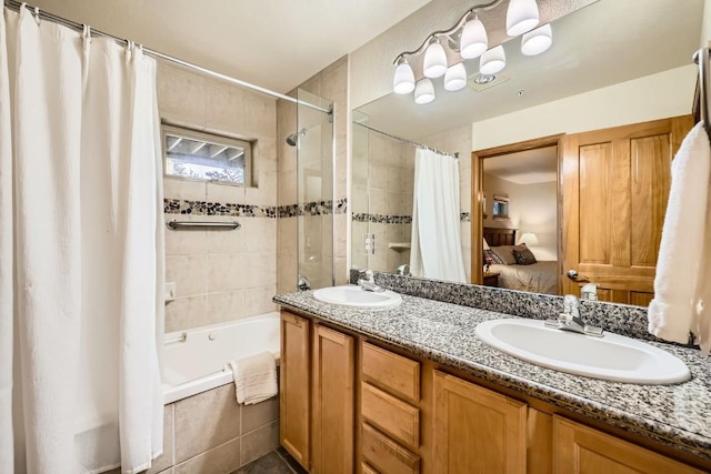 231 Creekside Dr Unit 102, Frisco, CO 80443 - full bathroom featuring tiled shower / bath combo, ensuite bath, and double vanity