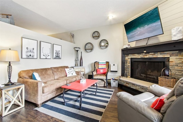 22320 US Highway 6 Unit 1762, Keystone, CO 80435 - living room with wood finished floors, a stone fireplace, and vaulted ceiling