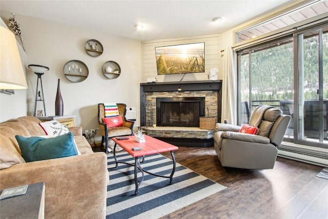 22320 US Highway 6 Unit 1762, Keystone, CO 80435 - living room with wood finished floors, a fireplace, and baseboard heating