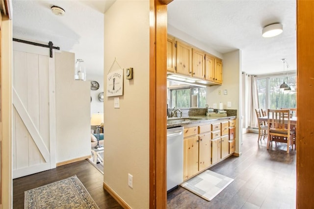 22320 US Highway 6 Unit 1762, Keystone, CO 80435 - kitchen with dishwasher, a barn door, a sink, dark wood-type flooring, and light brown cabinetry