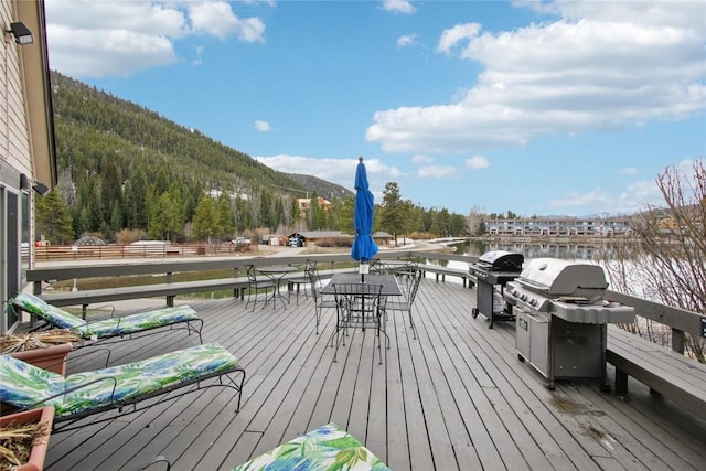 22320 US Highway 6 Unit 1762, Keystone, CO 80435 - deck with outdoor dining space, area for grilling, and a water and mountain view