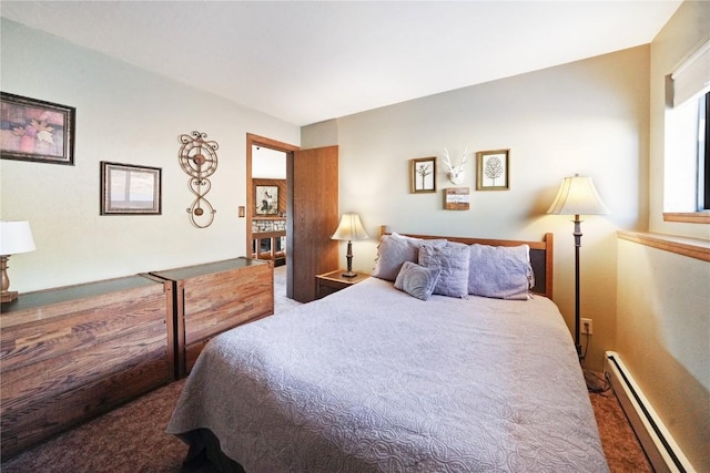 bedroom with carpet floors and a baseboard radiator