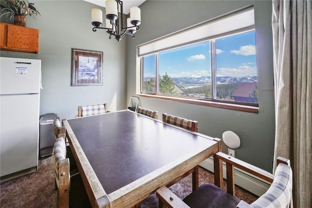 playroom featuring an inviting chandelier and carpet floors