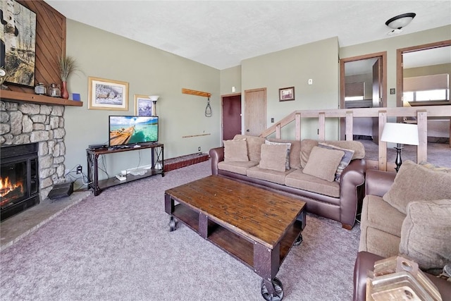 carpeted living area featuring baseboards and a fireplace