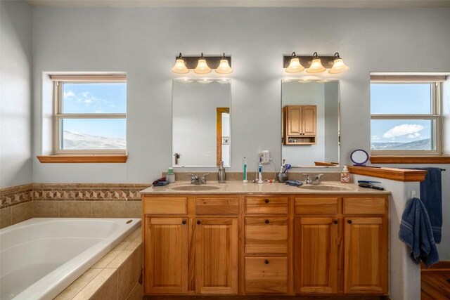 30225 Coyote Run Ct, Oak Creek, CO 80467 - full bath featuring double vanity, a sink, and a bath