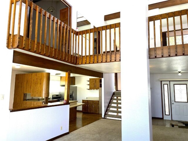 2584 High Creek Rd, Fairplay, CO 80440 - interior space with stairway, dark colored carpet, and a towering ceiling