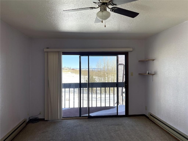 2584 High Creek Rd, Fairplay, CO 80440 - carpeted empty room featuring a baseboard heating unit, a ceiling fan, a textured wall, and a textured ceiling