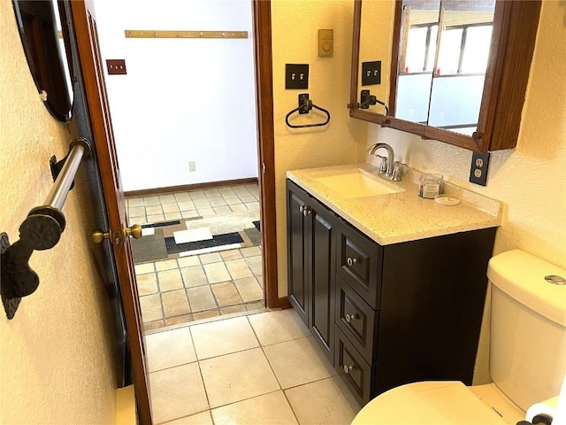 2584 High Creek Rd, Fairplay, CO 80440 - bathroom featuring a textured wall, toilet, and tile patterned floors