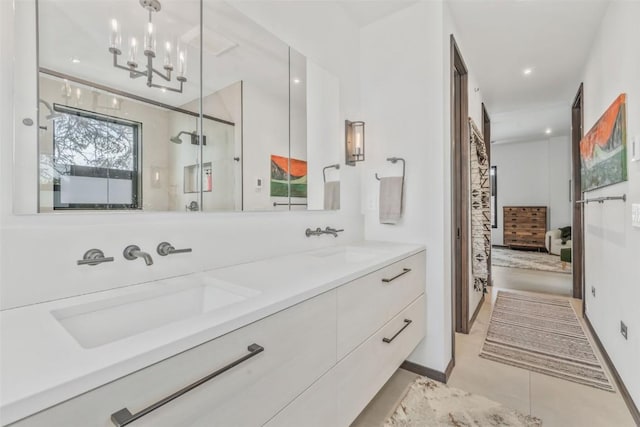 582 Laurel St, Steamboat Springs, CO 80487 - bathroom featuring connected bathroom, double vanity, a shower stall, tile patterned floors, and a chandelier
