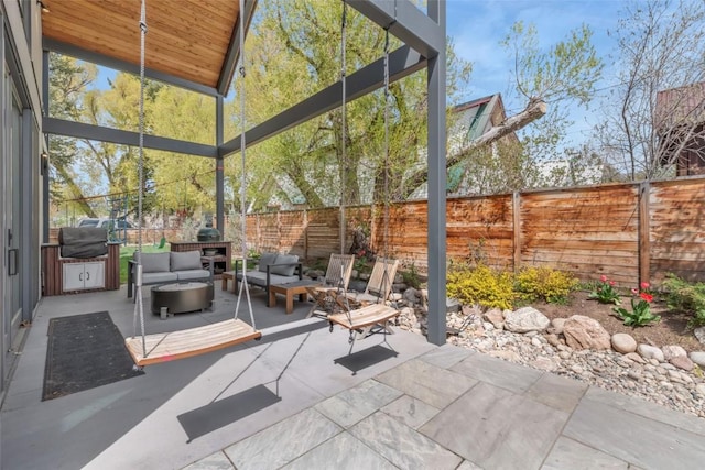 582 Laurel St, Steamboat Springs, CO 80487 - view of patio with outdoor lounge area, a fenced backyard, and area for grilling