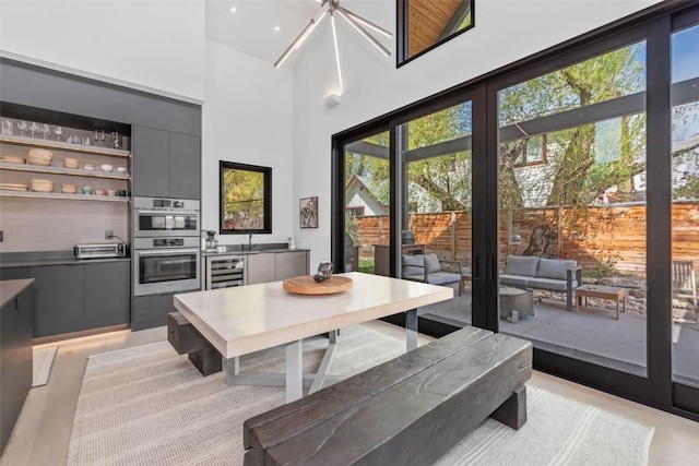 582 Laurel St, Steamboat Springs, CO 80487 - dining space with beverage cooler and a high ceiling