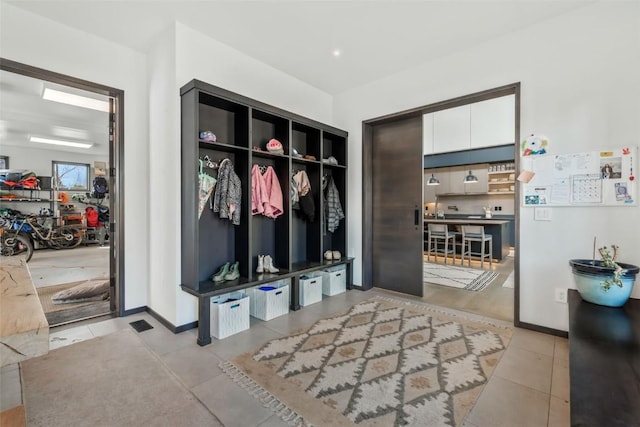 582 Laurel St, Steamboat Springs, CO 80487 - mudroom featuring tile patterned floors and baseboards