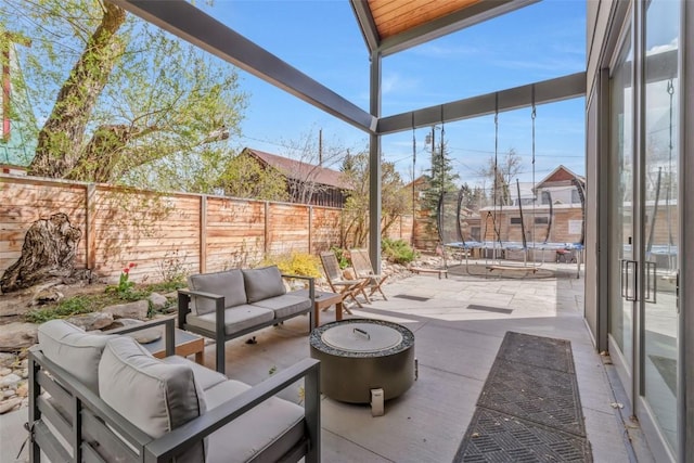 582 Laurel St, Steamboat Springs, CO 80487 - view of patio with a trampoline, outdoor lounge area, and a fenced backyard