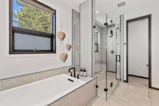 582 Laurel St, Steamboat Springs, CO 80487 - full bathroom with a stall shower, healthy amount of natural light, and a bathtub