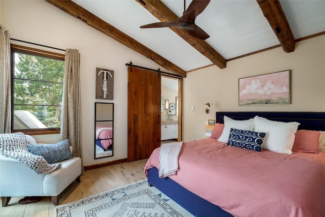 1511 Harwig Cir, Steamboat Springs, CO 80487 - bedroom featuring wood finished floors, ceiling fan, a barn door, lofted ceiling with beams, and ensuite bath