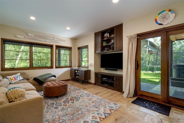 1511 Harwig Cir, Steamboat Springs, CO 80487 - living room featuring recessed lighting, baseboards, a healthy amount of sunlight, and light wood-type flooring