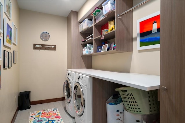 1511 Harwig Cir, Steamboat Springs, CO 80487 - washroom with light tile patterned floors, baseboards, laundry area, and washing machine and dryer