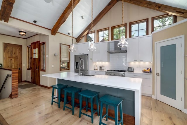 1511 Harwig Cir, Steamboat Springs, CO 80487 - kitchen with a sink, white cabinets, beamed ceiling, and stainless steel appliances