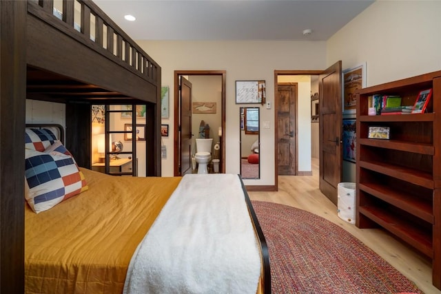 1511 Harwig Cir, Steamboat Springs, CO 80487 - bedroom with connected bathroom and light wood-style floors