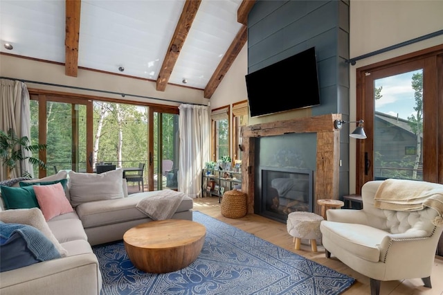 1511 Harwig Cir, Steamboat Springs, CO 80487 - living room with vaulted ceiling with beams, light wood-style flooring, and a fireplace