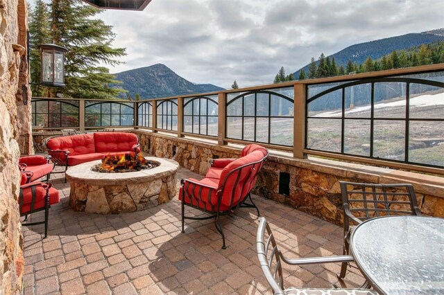 280 Trailhead Dr Unit 3037, Keystone, CO 80435 - balcony featuring a patio area, an outdoor living space with a fire pit, and a mountain view