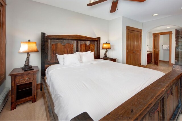 280 Trailhead Dr Unit 3037, Keystone, CO 80435 - bedroom featuring recessed lighting, a ceiling fan, arched walkways, a baseboard heating unit, and ensuite bathroom