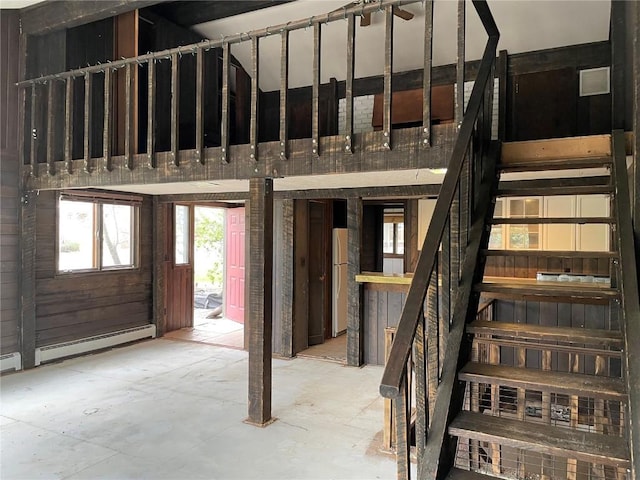 810 Broad St, Steamboat Springs, CO 80487 - stairway featuring a baseboard radiator and unfinished concrete flooring