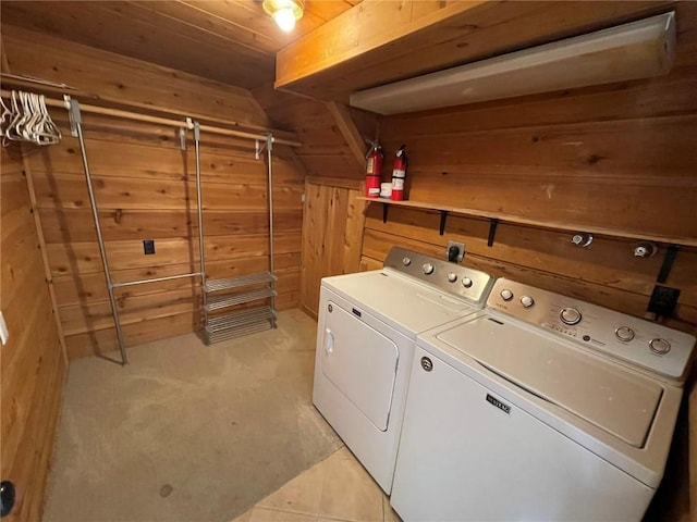810 Broad St, Steamboat Springs, CO 80487 - laundry area featuring washing machine and clothes dryer, wooden walls, light colored carpet, and wood ceiling