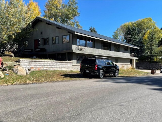 810 Broad St, Steamboat Springs, CO 80487 - view of front facade with metal roof