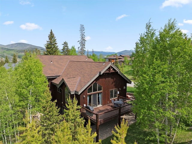 736 Wild Rose Rd, Silverthorne, CO 80498 - back of house featuring a shingled roof and a deck with mountain view