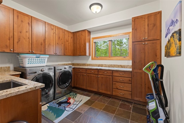 736 Wild Rose Rd, Silverthorne, CO 80498 - laundry room featuring washer and dryer, cabinet space, and dark stone finish flooring