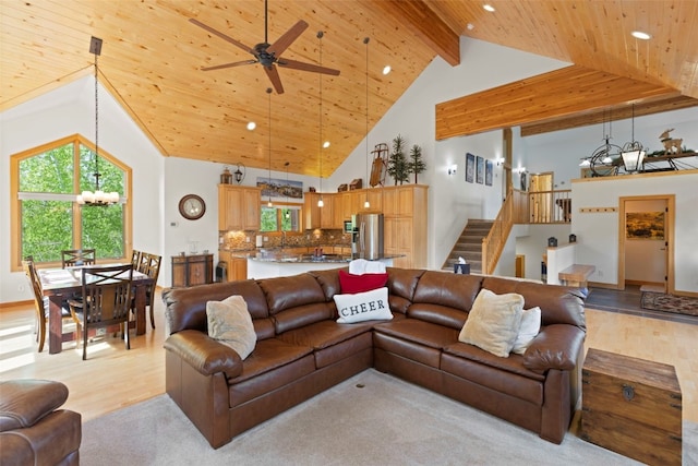 736 Wild Rose Rd, Silverthorne, CO 80498 - living area with a wooden ceiling with exposed beams, light wood-style floors, stairs, ceiling fan, and high vaulted ceiling