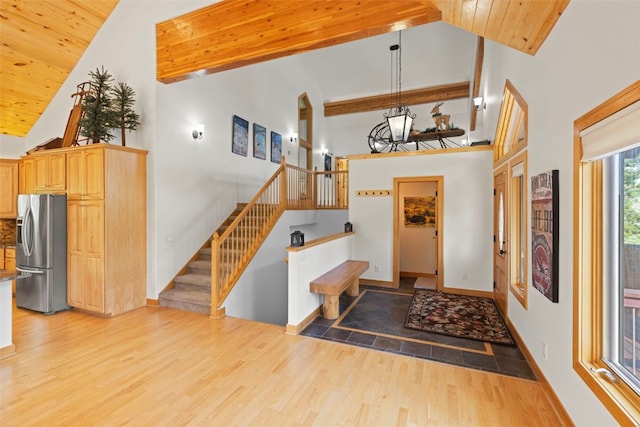 736 Wild Rose Rd, Silverthorne, CO 80498 - entryway with high vaulted ceiling, light wood-type flooring, stairway, a chandelier, and wood ceiling