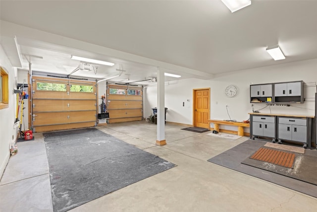 736 Wild Rose Rd, Silverthorne, CO 80498 - garage with a workshop area and a garage door opener
