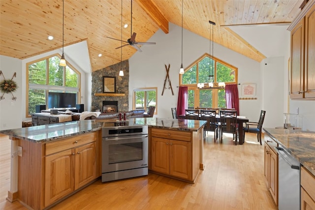 736 Wild Rose Rd, Silverthorne, CO 80498 - kitchen featuring dishwasher, oven, high vaulted ceiling, a wooden ceiling with exposed beams, and a stone fireplace
