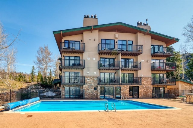 2883 Burgess Creek Rd Unit 101, Steamboat Springs, CO 80487 - pool with a patio and fence