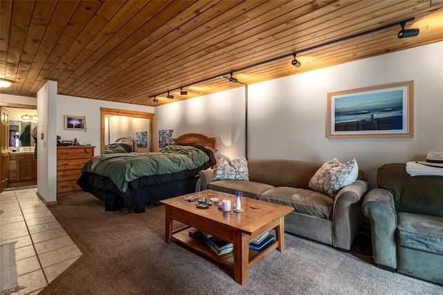 2883 Burgess Creek Rd Unit 101, Steamboat Springs, CO 80487 - bedroom with track lighting, carpet floors, and wood ceiling