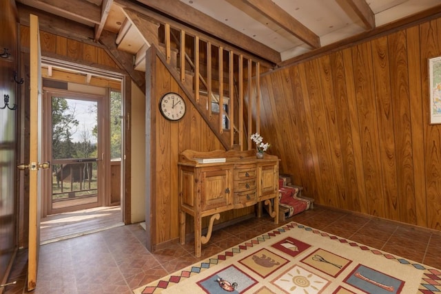 33 Sugar Loaf Ln, Jefferson, CO 80456 - interior space with tile patterned floors, wooden walls, and stairway