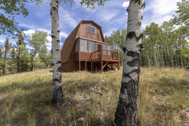 33 Sugar Loaf Ln, Jefferson, CO 80456 - back of house with a gambrel roof and a deck