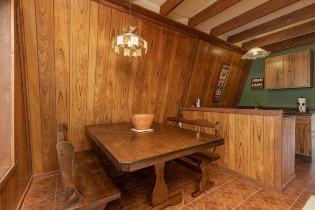 33 Sugar Loaf Ln, Jefferson, CO 80456 - dining room featuring tile patterned flooring, wood walls, and beam ceiling
