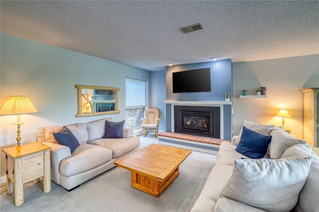 2510 Ryan Gulch Rd Unit 2512, Silverthorne, CO 80498 - living room with carpet, a fireplace, and a textured ceiling