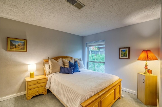 2510 Ryan Gulch Rd Unit 2512, Silverthorne, CO 80498 - bedroom featuring light carpet and a textured ceiling
