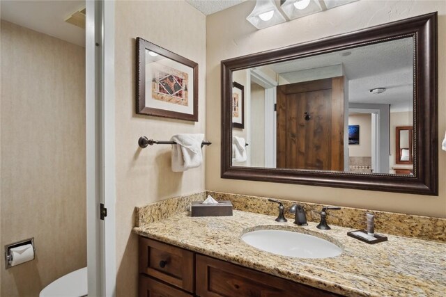 640 Village Rd Unit 4423, Breckenridge, CO 80424 - half bath with a textured ceiling, toilet, and vanity