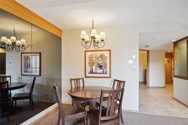 640 Village Rd Unit 4423, Breckenridge, CO 80424 - dining space with baseboards and a notable chandelier