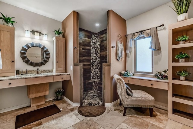 53 Anhinga Rd, Como, CO 80432 - full bathroom with stone tile floors, baseboards, vanity, and a walk in shower