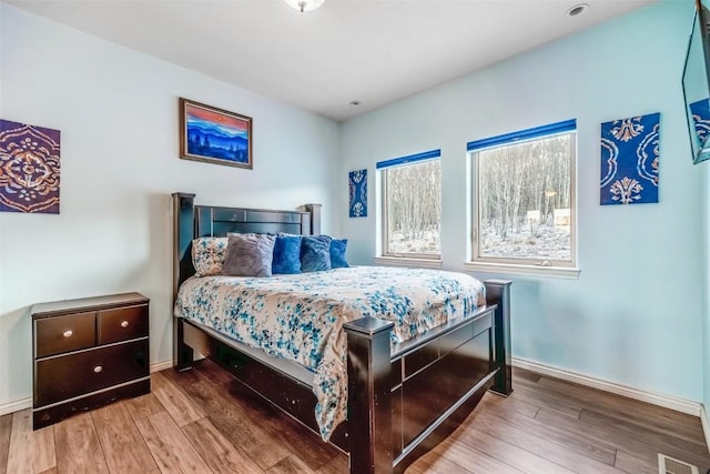 53 Anhinga Rd, Como, CO 80432 - bedroom with baseboards, wood finished floors, and visible vents