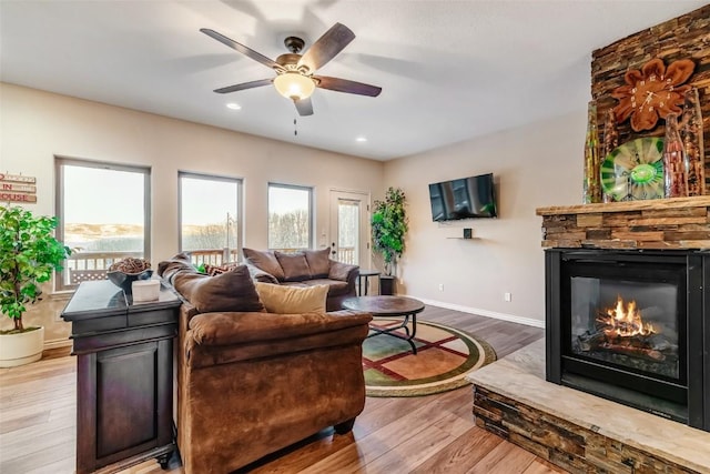 53 Anhinga Rd, Como, CO 80432 - living room featuring recessed lighting, wood finished floors, baseboards, a fireplace, and ceiling fan