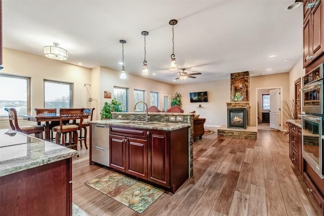53 Anhinga Rd, Como, CO 80432 - kitchen with ceiling fan, appliances with stainless steel finishes, wood finished floors, and a sink