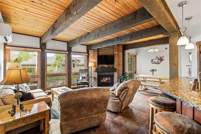 2700 Village Dr Unit C107, Steamboat Springs, CO 80487 - living area with wooden ceiling with exposed beams, a brick fireplace, and a wall mounted AC