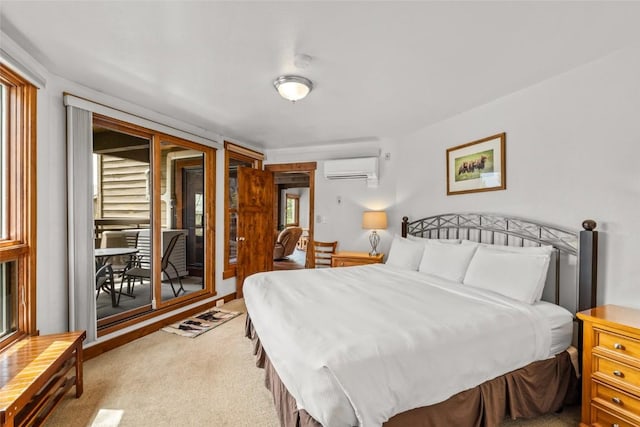 2700 Village Dr Unit C107, Steamboat Springs, CO 80487 - bedroom featuring a wall mounted AC, light carpet, multiple windows, and access to outside